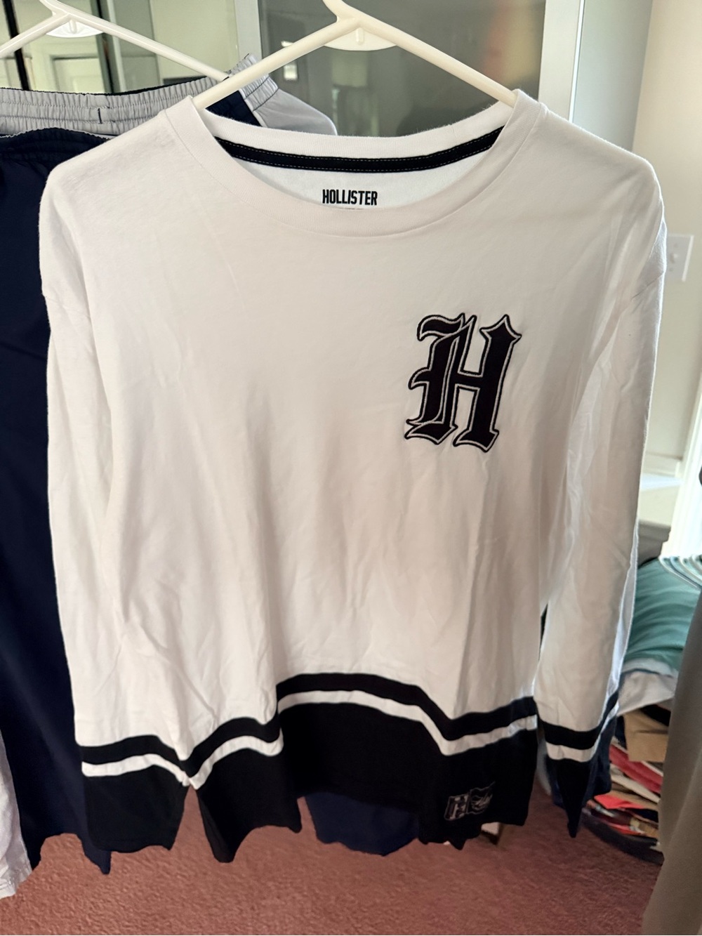 Hollister White Long Sleeve Tee with Black Trim and 'H' Graphic